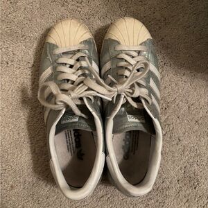 Silver and white adidas sneakers